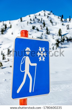 sign for a winter hiking trail in austria - photo