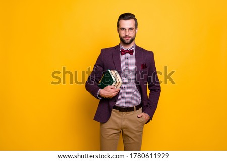 Photo of handsome cheerful rich clothes guy student hold many books university college young professor wear specs plaid shirt blazer isolated yellow color background