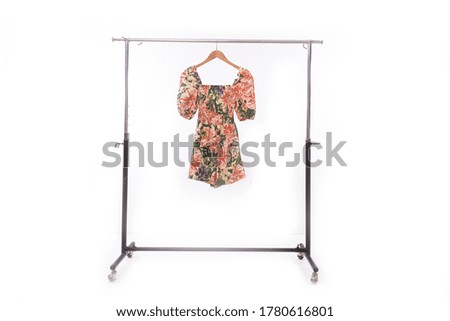 Fashion dress with floral ,leaf, plants pattern on hanger

