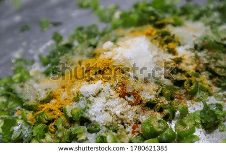 Blured out picture of Mixture of Indian Spices (Masala) in a plate.