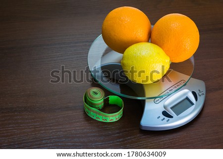 Restriction in nutrition. Measuring tape on the table with space for text. Slimming. Weight loss concept, weight management, change to a healthy lifestyle, weight loss health and social problem Royalty-Free Stock Photo #1780634009