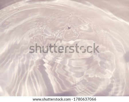 Closeup​ abstract​ of​ surface​ blue​ water​ for​ background. Reflection​ on surface​ natural​ water​ for​ background. Water​ splashed​ for​ graphic​ design.