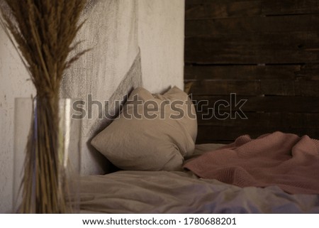 A vase with dry flowers on a table. Scandinavian classic room with wooden and white details, minimalistic interior design. Real photo. Cosy home