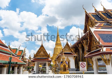 picture of The Temple of the Emerald Buddha  in the sunny day with blue sky in Bangkok, Thailand