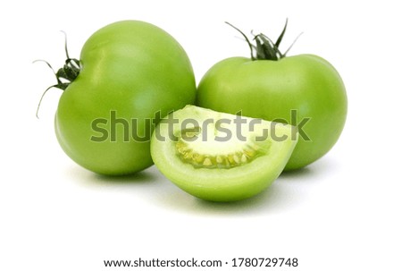 green tomatoes on white background