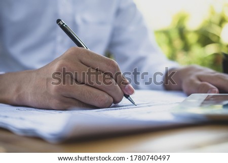 Close up hand writting on paperwork from,Concept business finance work job professional pen paper