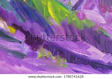 Abstract multi-colored background with oil paint. Hand-made textured background for signage and banners. A picturesque fragment of purple, green and pink shades. Mixing oil paints on canvas.