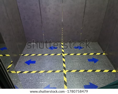 Elevator standing position symbol stand spaced distancing new normal, protect diffusion viruscorona covid-19