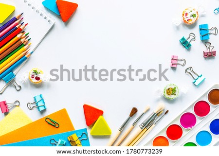 Different colorful stationery for school on white background with copyspace.