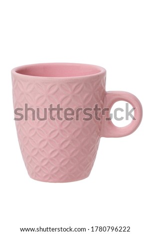  Mug of coffee. Closeup of a pink ceramic mug or tea cup isolated on a white background. Macro.