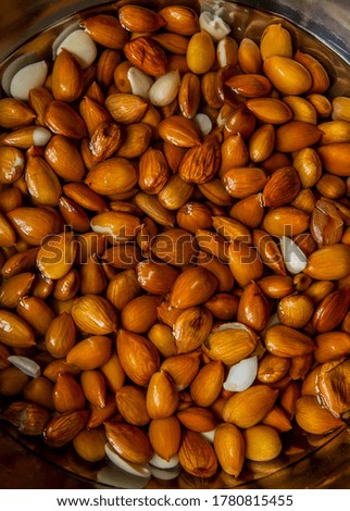 almonds as background, top view. Healthy snack. Wet almonds. Peeled almond