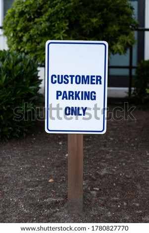 "Customer Parking Only" sign at an office building
