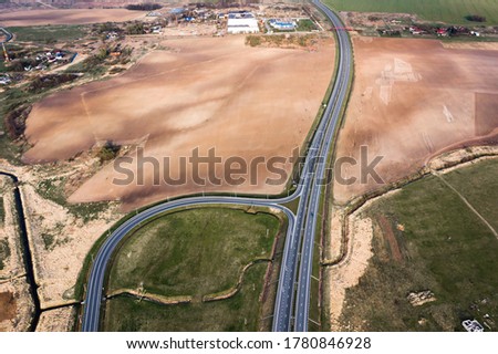 Highway, roadway outside city. Aerial view.