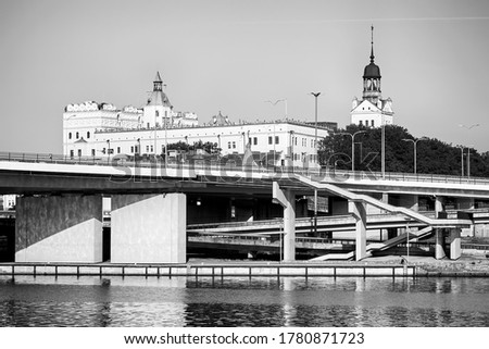 Black and white picture of Szczecin Odra River waterfront with the Pomeranian Dukes Castle, Poland.