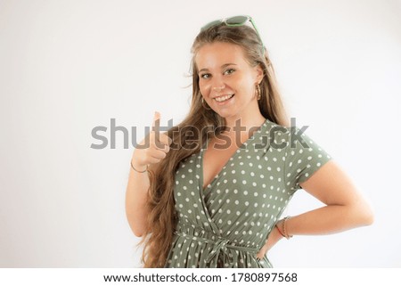 Portrait of a pretty young girl in green dress