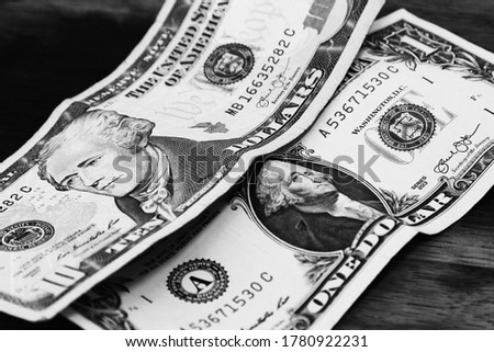 USA money on a wooden table. Economic stimulus package concept image. 