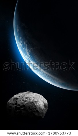 Asteroid near Earth sufrace. Planet in dark space. Vertical sci fi wallpaper. Elements of this image furnished by NASA