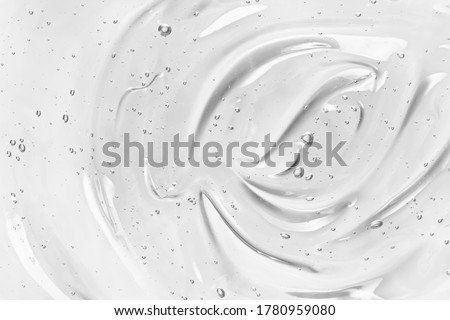 Face serum or gel texture. Clear skincare cream with bubbles background. Transparent cosmetic gel product strokes closeup  Royalty-Free Stock Photo #1780959080