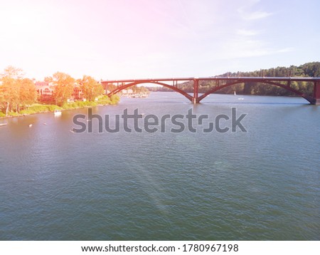 Bridge in Portland Oregon at sunset, city and river, aerial view