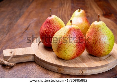 Fresh ripe red yellow forelle pears fruit from Germany close up