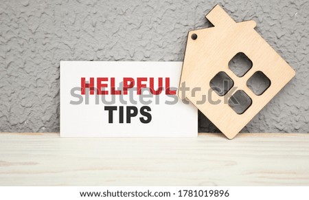 Text helpful tips on note paper and wood