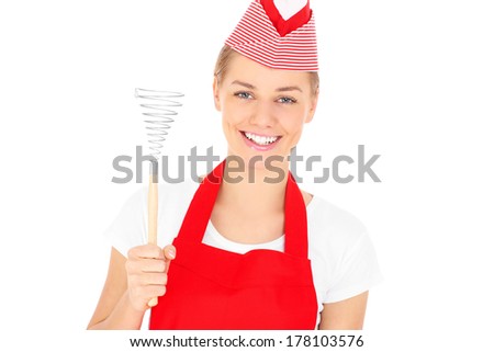 A picture of a happy woman holding a whisk over white background