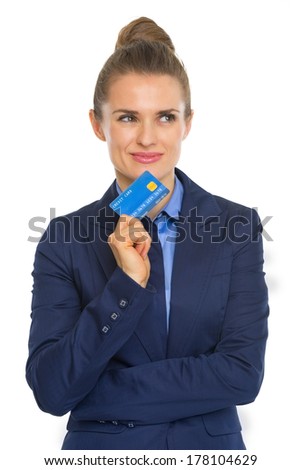 Portrait of thoughtful business woman with credit card