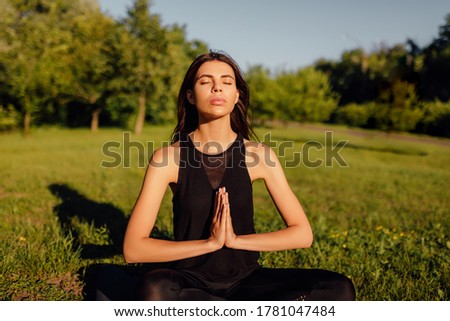 Young woman practicing yoga. Harmony and meditation concept. Healthy lifestyle