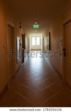 hallway in vintage hotel in day time with safety precautions