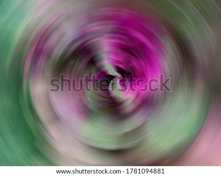 Abstract background of spin circle radial blur with green and purple tone.