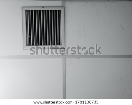 Aluminium ventilation grille on ceiling, using for supply or return air in the room and offering protection against foreign objects entering ductwork. Air vent ventilation cover.