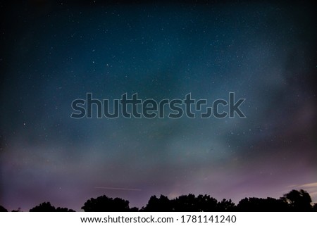 Astrophoto of Ursa minor, Cassiopeia, Polaris, and more. Along with a nice streak of the International Space Station on the bottom center.  Royalty-Free Stock Photo #1781141240