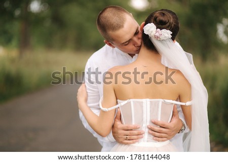 Portrait of groom and bride in their wedding day. Summer wedding