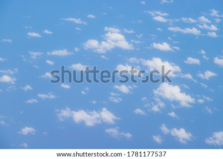 Capturing the fluffy white clouds and the blue sky View from plane