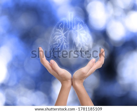 World Tuberculosis Day and No Tobacco campaign. Woman holding lungs illustration on blurred background, closeup Royalty-Free Stock Photo #1781185109