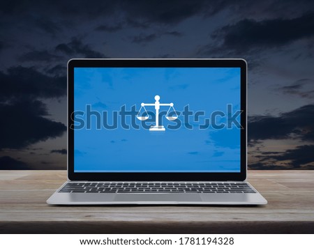 Law flat icon with modern laptop computer on wooden table over sunset sky, Business legal service online concept