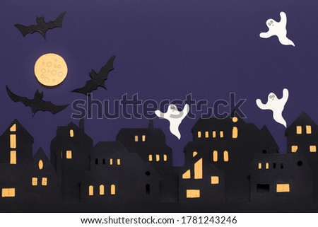 Modern paper cut flat lay with black halloween background. Cartoon character. Copy space