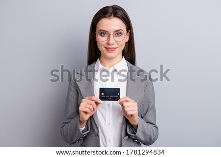 Photo of attractive business lady confident manager hold plastic credit card bank novelty platinum gold client bonus money wear specs shirt plaid blazer isolated grey color background