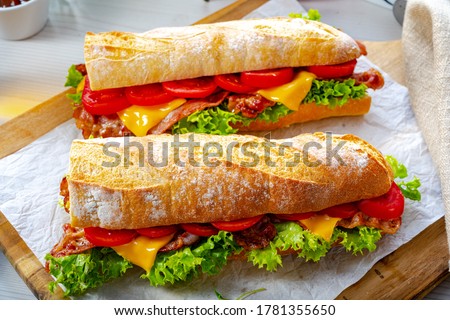crispy baguette with bacon, tomatoes and cheese