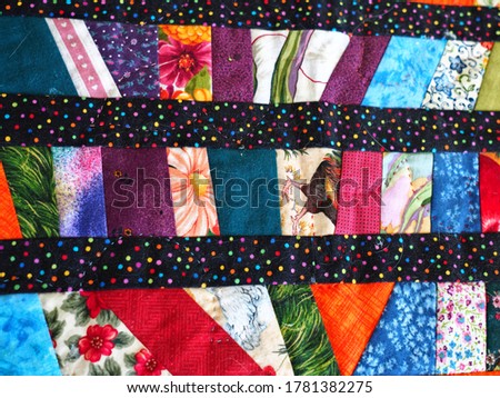 Closeup of beautiful creative colorful textile handmade handcraft Patchwork quilt