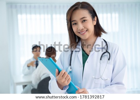An Asian female doctor smiled friendly while working in the hospital. Concepts of health care, plastic surgery, beauty care