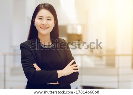 The concept of a modern business woman is smiling and happy In the office with copy space
