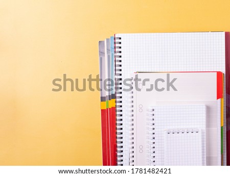 stationary items on yellow as studying or schooling concept