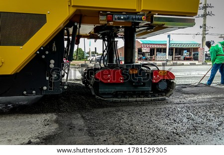 Heavy construction equipment working to widen a roadway
