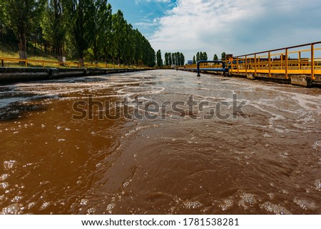 Modern wastewater treatment plant. Tanks for aeration and biological purification of sewage Royalty-Free Stock Photo #1781538281