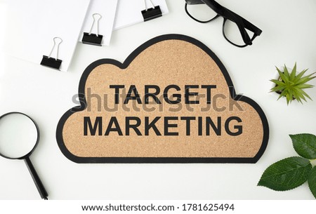 word or tag cloud labeled Target marketing. Documents and office supplies around the inscription.