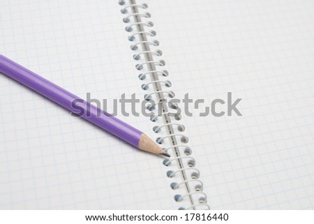 opened notebook with pencil