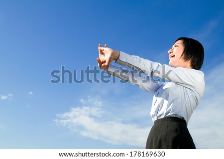 Young woman who made the blue sky the background  