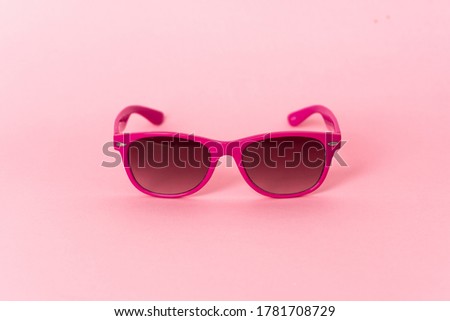 Pink glasses over isolated background
