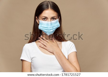 Pretty woman fashion clothes in a medical mask pandemic 
